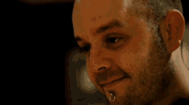 a close up of a man 's face with a lot of white powder on it .