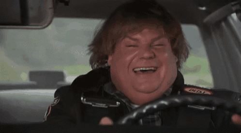 a man is driving a car with a sticker on his jacket that says dusty