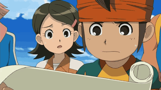 a boy and a girl are looking at something