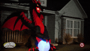 an airblown inflatable dragon is sitting in front of a building