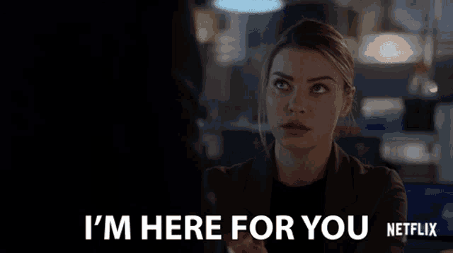 a woman says i 'm here for you on a netflix screen