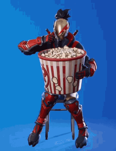 a video game character is sitting on a chair holding a large bucket of popcorn
