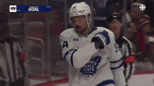 a hockey player with the number 34 on their jersey