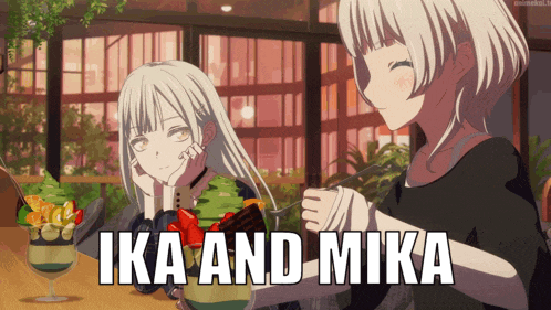 a couple of anime girls sitting at a table with the words ika and mika on the bottom