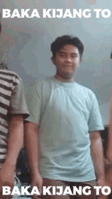 a man in a blue shirt is standing next to two other men and says baka kijang to baka kijang to .