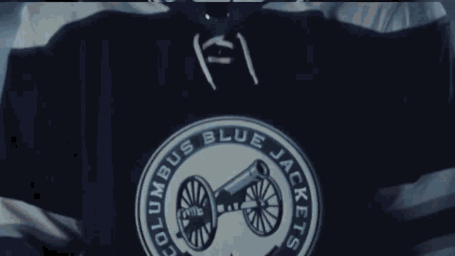 a columbus blue jackets jersey with a cannon on the front