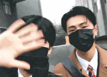 two men wearing face masks are standing next to each other and the words svrjoyhaven are on the bottom right