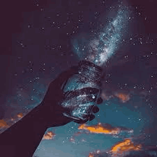 a person is holding a jar of milky way dust in front of a starry sky .