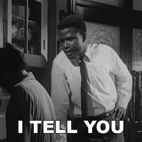 a man in a white shirt and tie is standing next to a woman and says " i tell you "