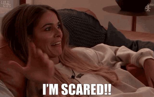 a woman laying on a couch with the words i 'm scared on the bottom