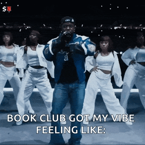 a man is standing in front of a group of dancers and says book club got my vibe feeling like .