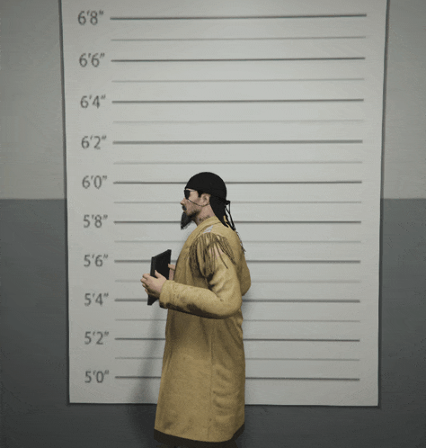 a man is standing in front of a wall with measurements for height