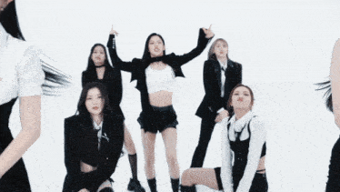 a group of women are dancing and one of them is wearing a choker