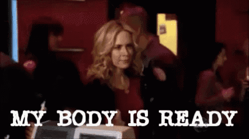 a woman is standing in a crowd with the words " my body is ready " behind her