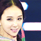 a close up of a woman 's face with a blurred background