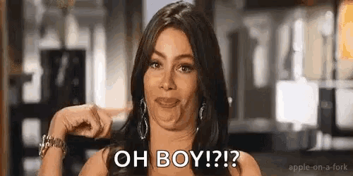 a woman is making a funny face and pointing at the camera while saying `` oh boy ! ''