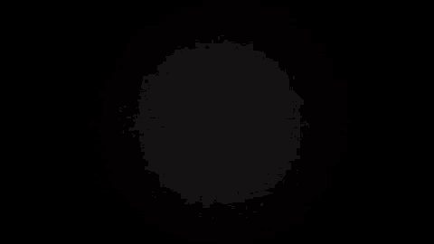 the letter a is glowing in the dark on a black background .