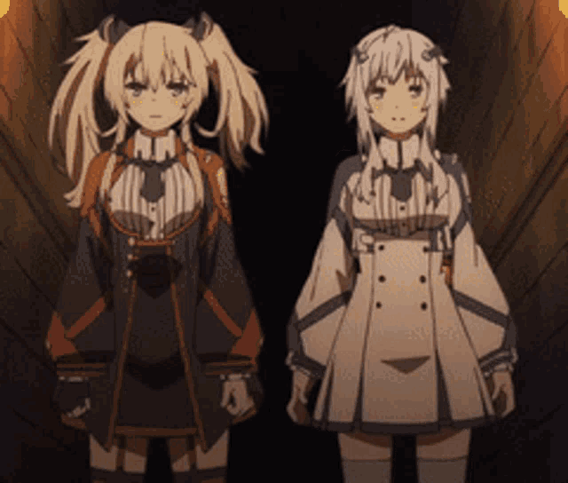 two anime characters standing next to each other in a dark room