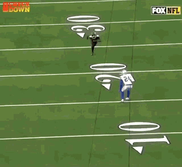 a football player with the number 18 on his jersey catches a pass