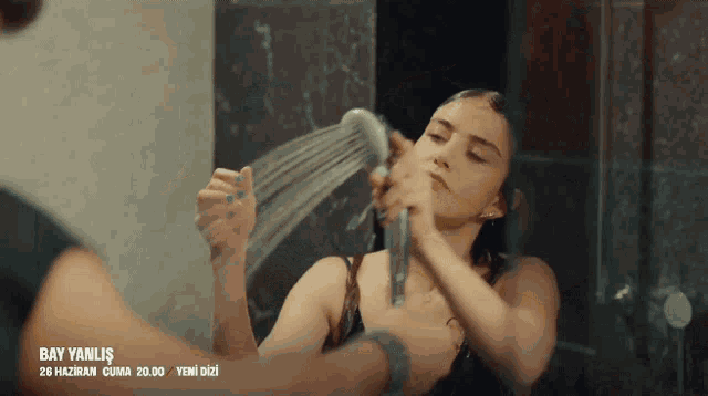 a woman is taking a shower with the date bay yanlis on the bottom