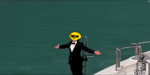a man in a tuxedo is standing on the side of a boat with his arms outstretched