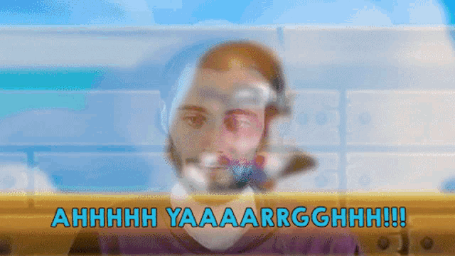 a blurry picture of a man with the words ahhhh yaaaarrgghhh in blue