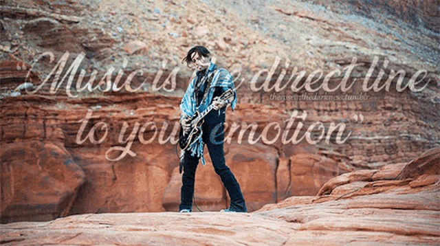 a man playing a guitar in the desert with the words music is the direct line to your emotion