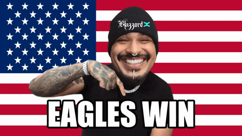 a man in front of an american flag with the words eagles win below him