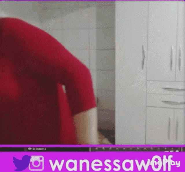 a woman in a red shirt is dancing in front of a screen that says wanessawoff by