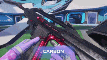 a person is holding a gun that says carbon on the bottom