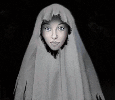 a ghost with glowing eyes is wearing a white sheet