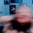 a blurry picture of a person 's face with a blurred background .