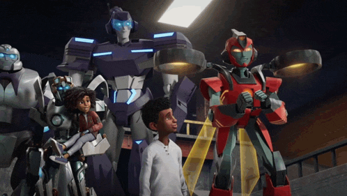a group of robots are standing next to a boy