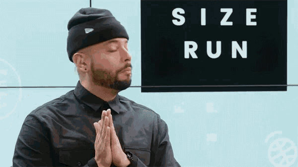 a man with his eyes closed prays in front of a sign that says size run
