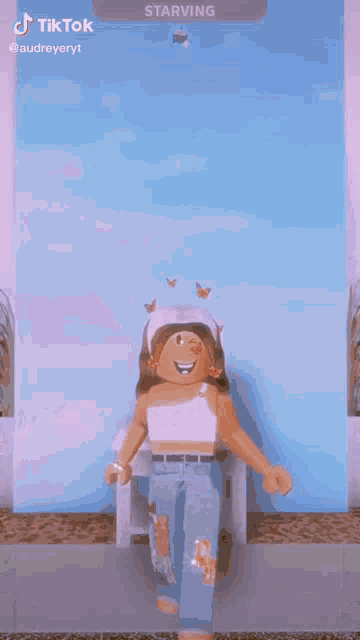 a person is standing on top of a mountain with butterflies flying around .