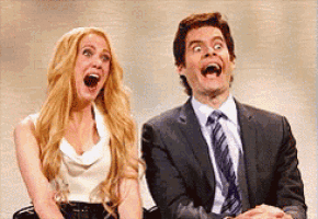 a man and a woman are sitting next to each other and making funny faces