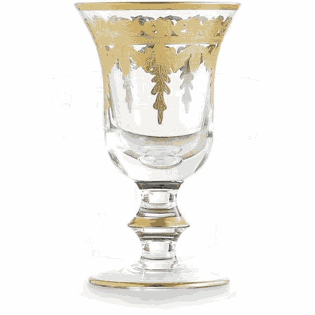 a clear glass bowl with a gold leaf design on it