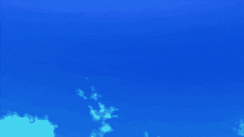 a girl with red hair and a blue skirt has her arms up in the air