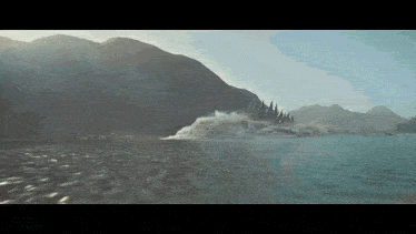 a boat is floating on top of a body of water .