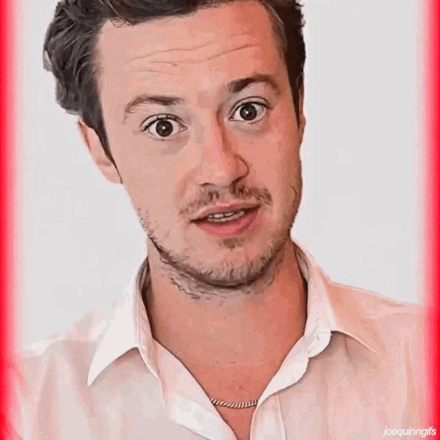 a close up of a man 's face with joequinngifs written on the bottom right corner