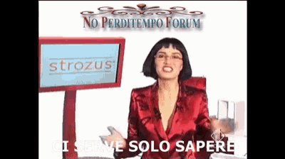 a woman stands in front of a screen that says strozus on it