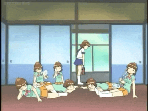 a group of girls are laying on the floor in a room with a girl standing in the background .