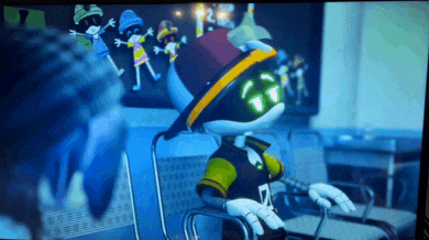 a robot wearing a hat and a shirt with the number 7 on it sits in a chair
