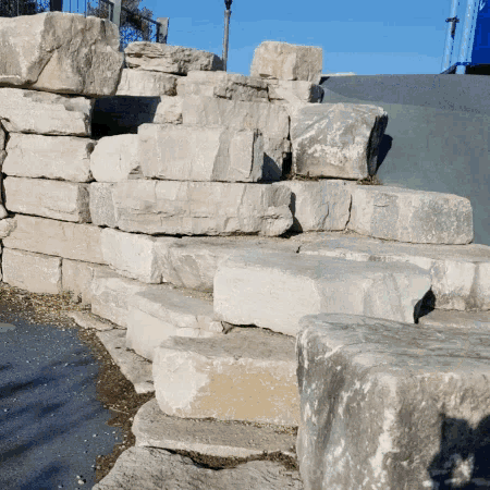 a stack of large rocks sitting on the ground
