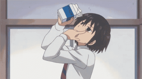 a boy is drinking from a carton that says milk on it