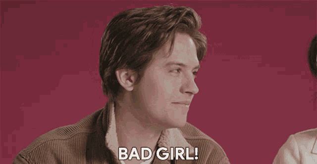 a man in a brown jacket says " bad girl "