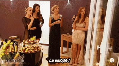 a group of women are standing in a room and one of them says la salope !