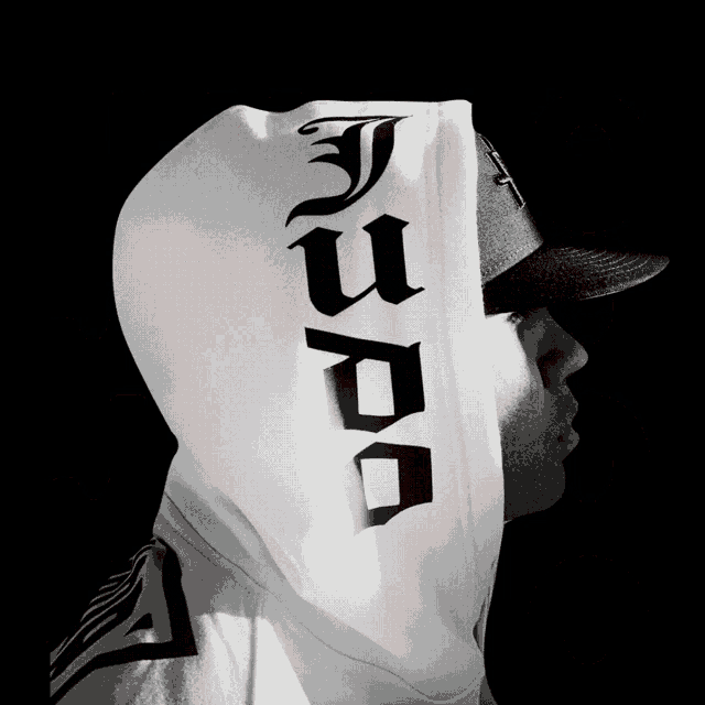 a black and white photo of a man wearing a white hoodie that says judo