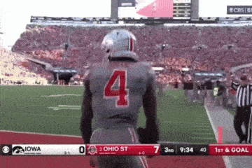 a football player with the number four on his jersey