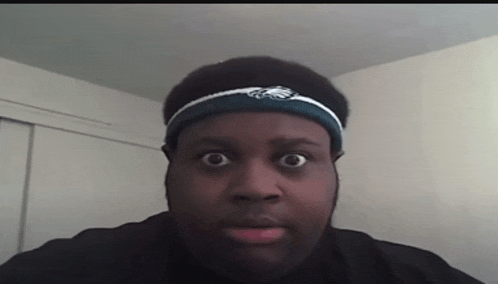 a man wearing a headband with the eagles on it